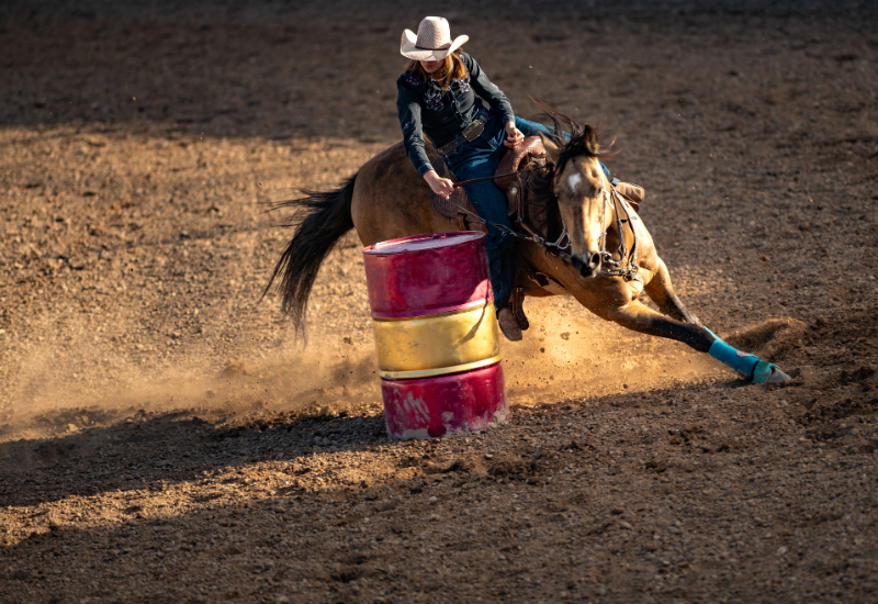 Horse rider rounding a barrel