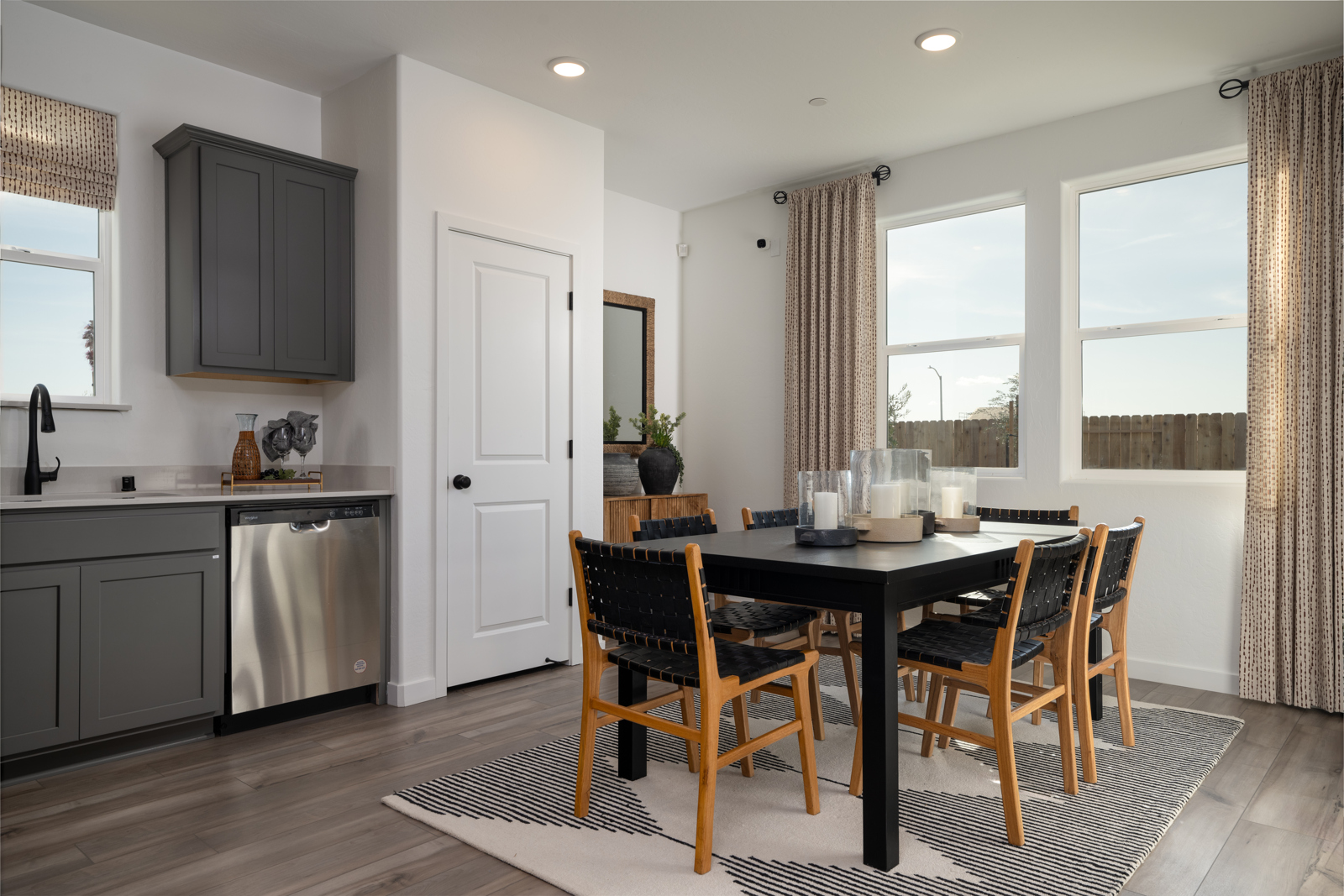 A kitchen with a dining table.