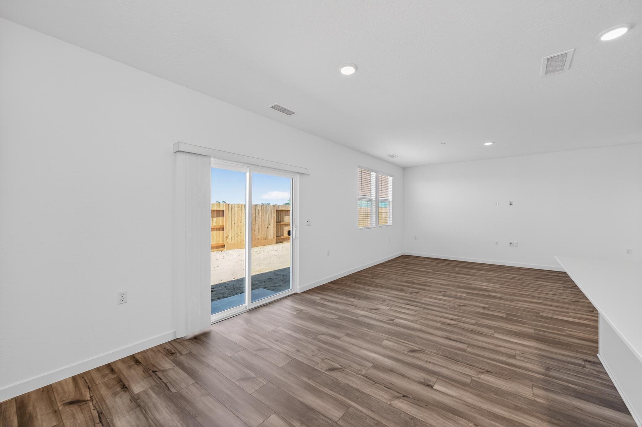 A room with a wood floor and a wood floor with a wood floor.