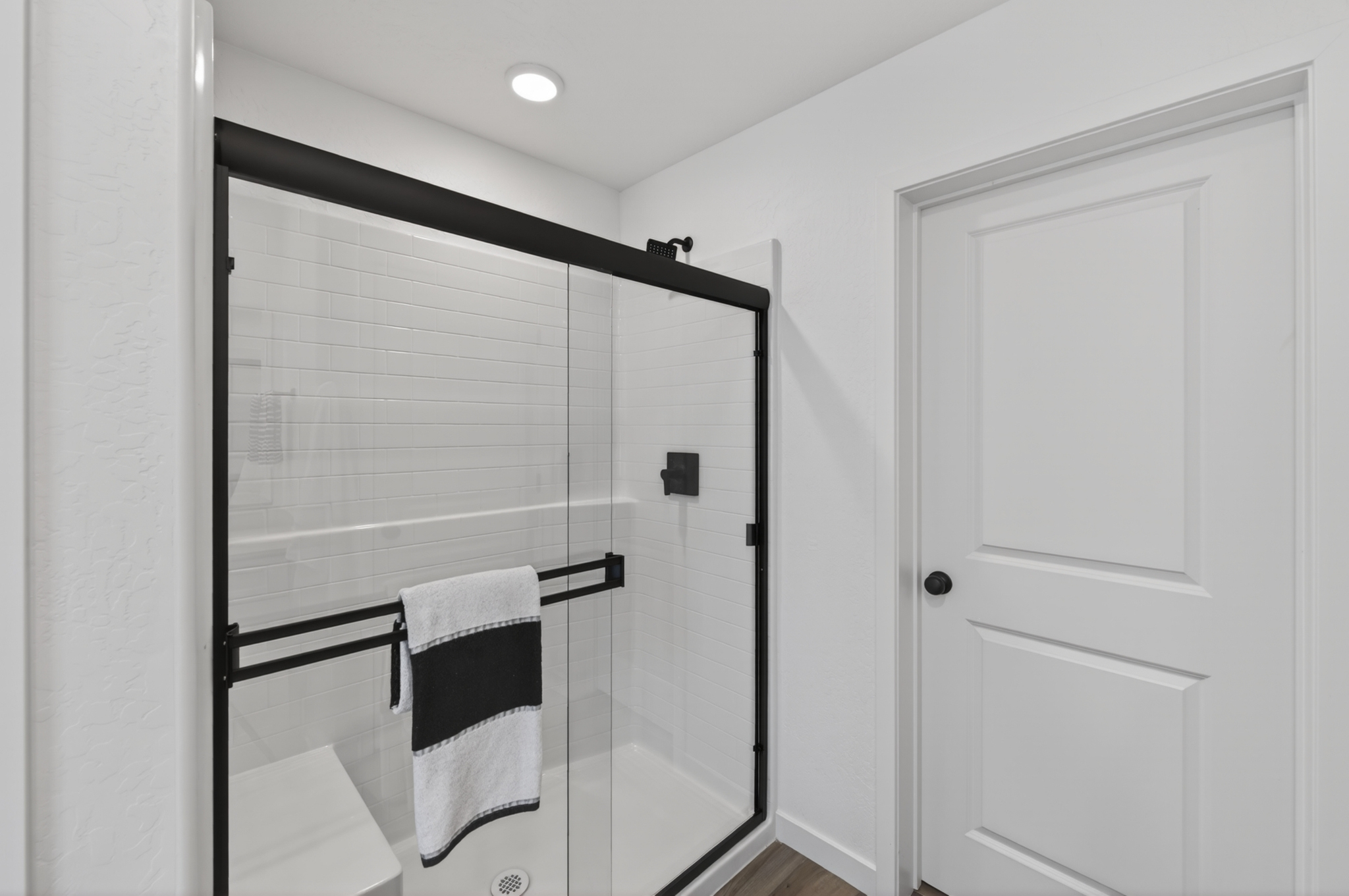 A bathroom with a glass shower.