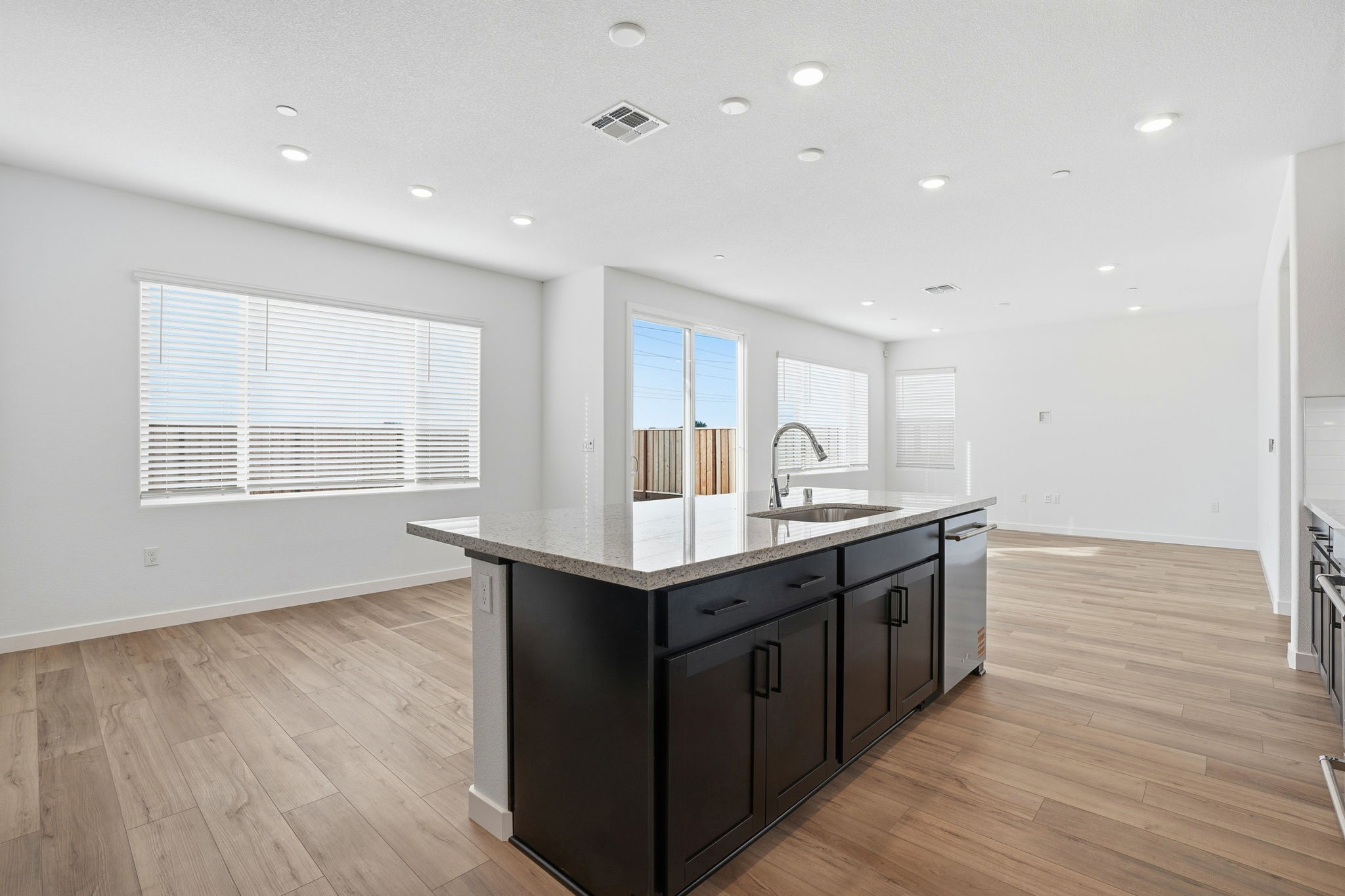 A kitchen with a wood floor.