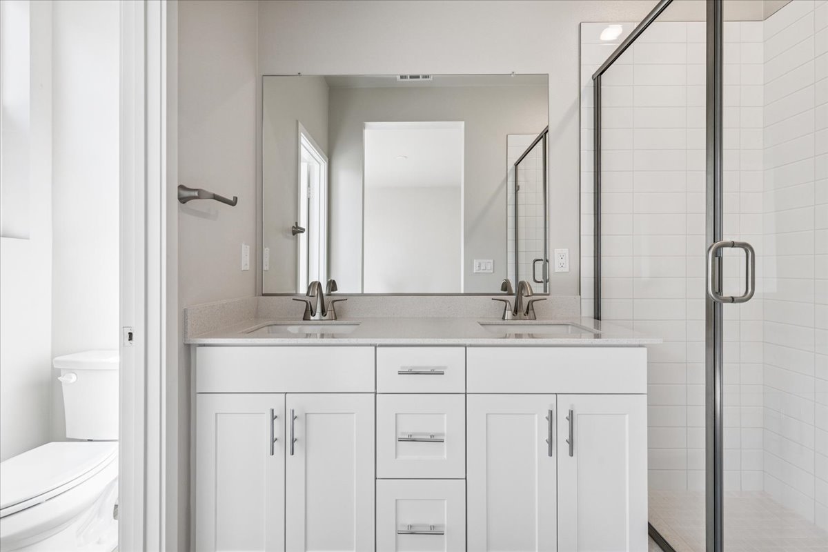 A bathroom with a glass shower.