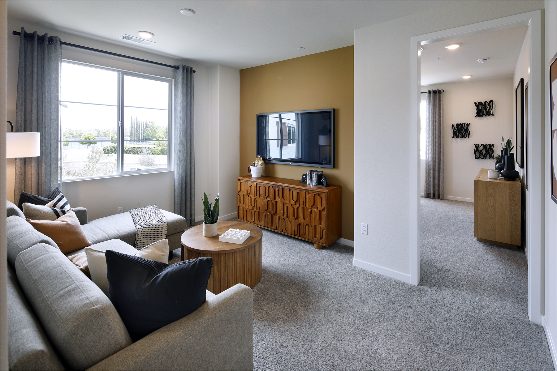 A living room with a large window.