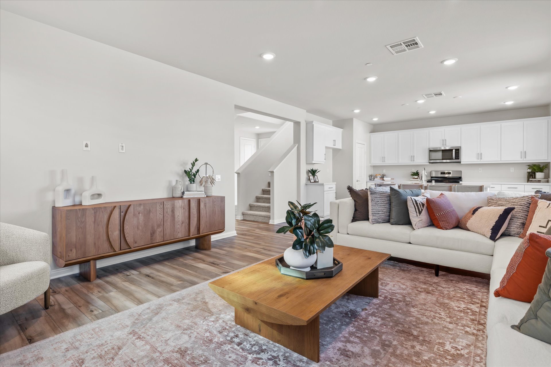 A living room with a couch and a table.