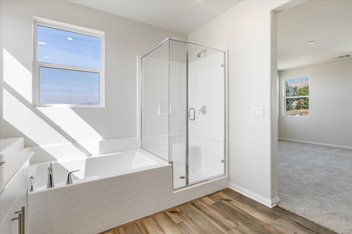 A bathroom with a glass shower.