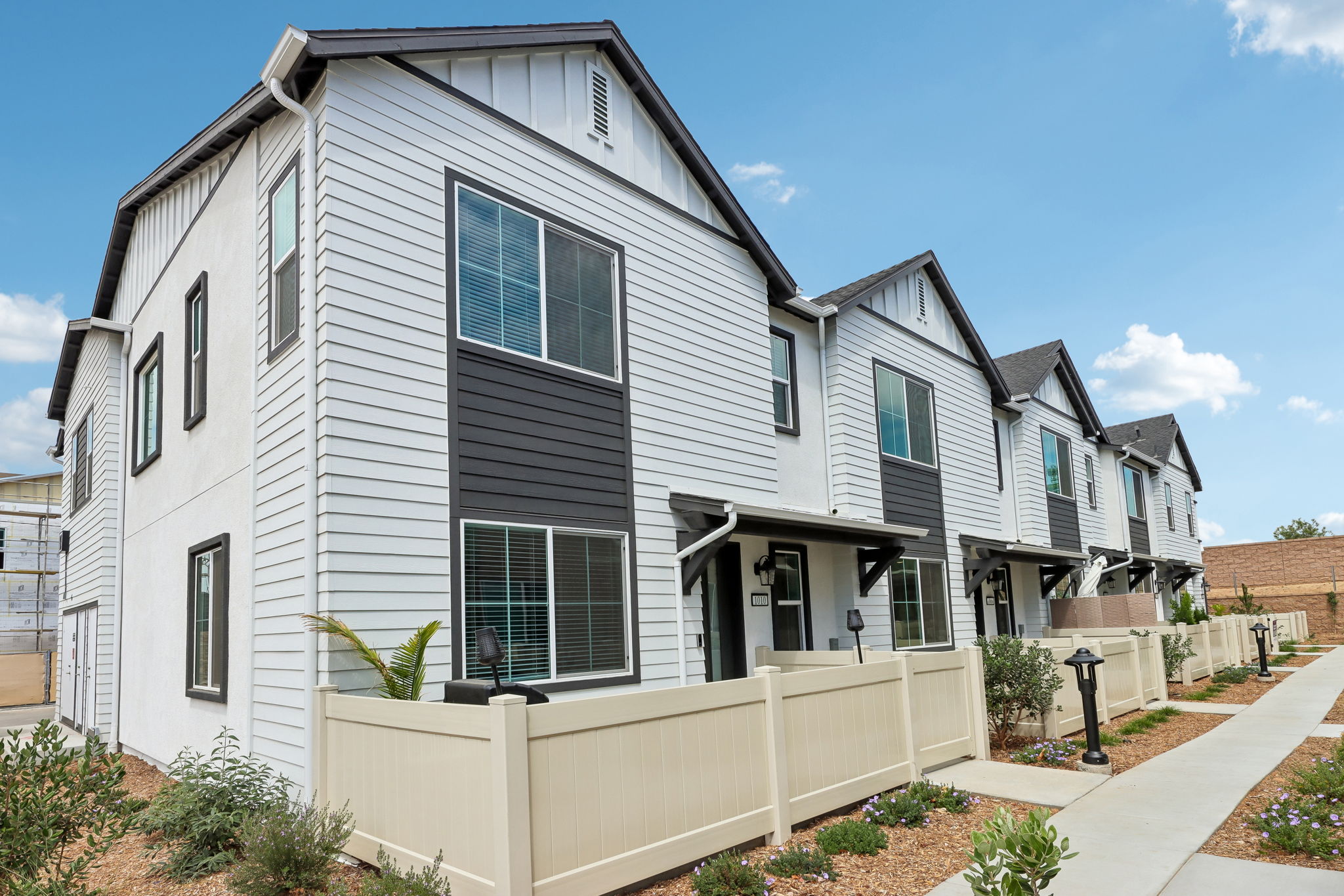 A white house with blue windows.