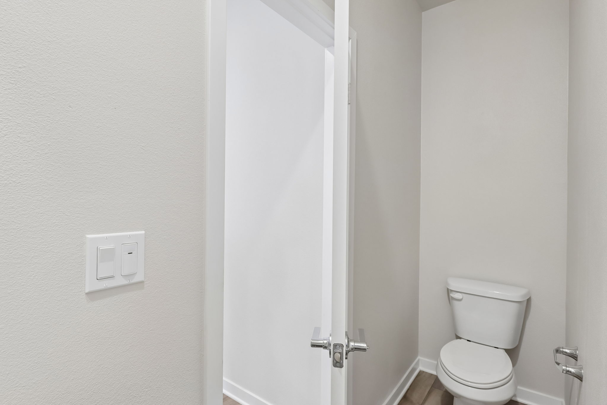 A toilet in a bathroom.