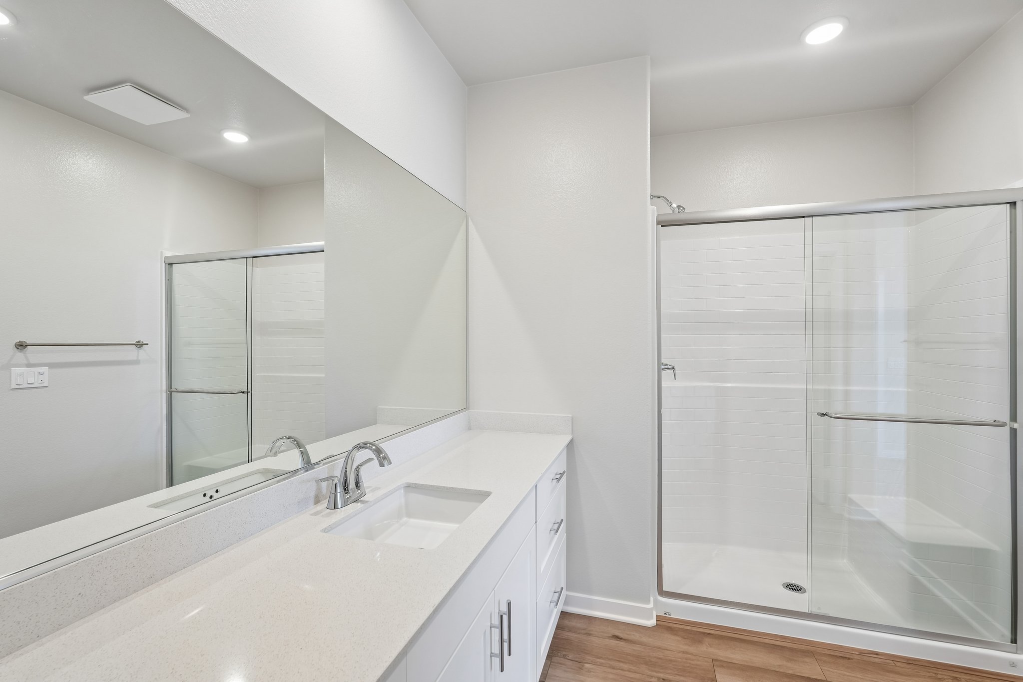 A bathroom with a glass shower.
