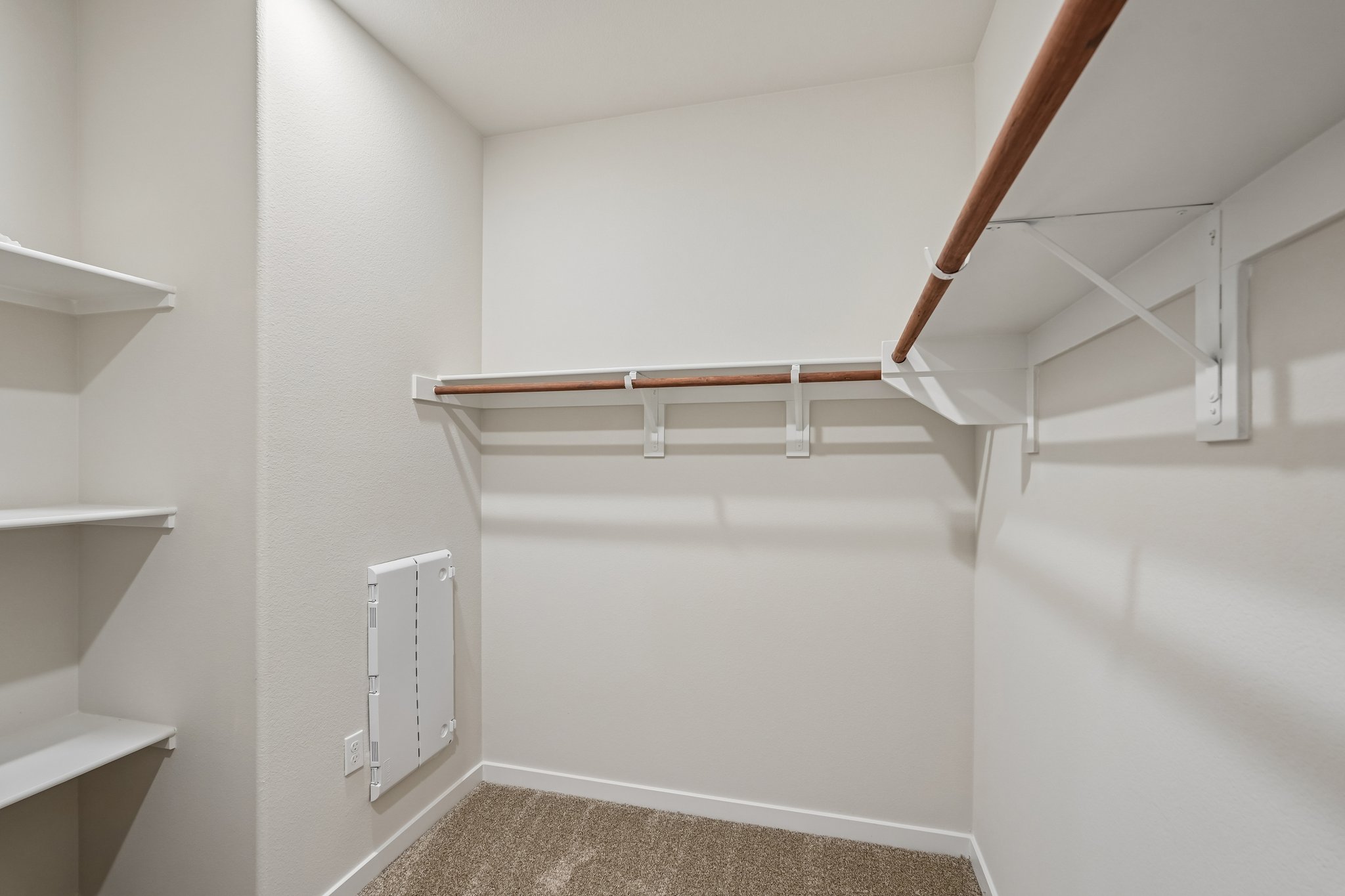 A white room with a white wall and a white floor.