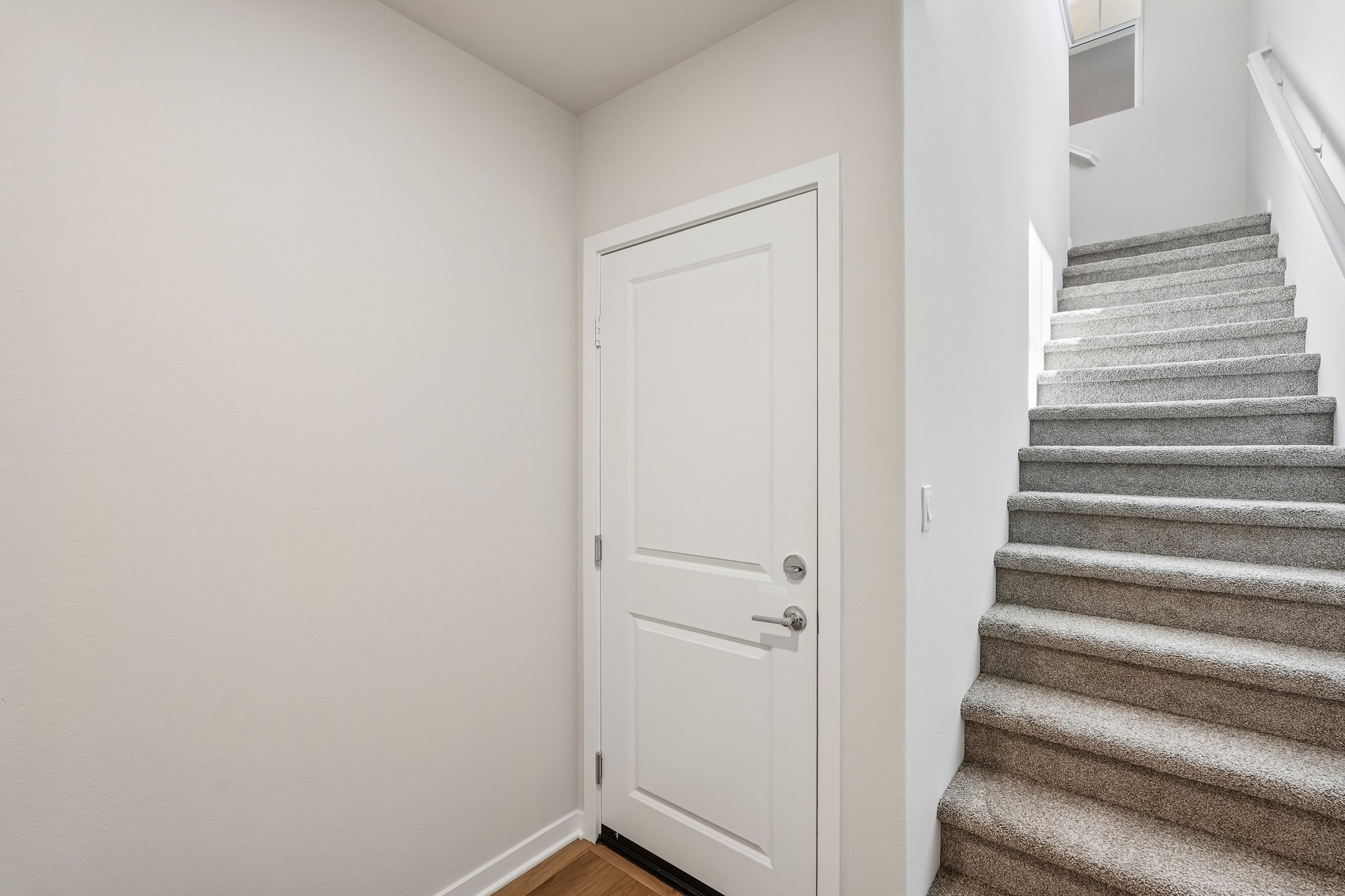 A staircase leading to a door.