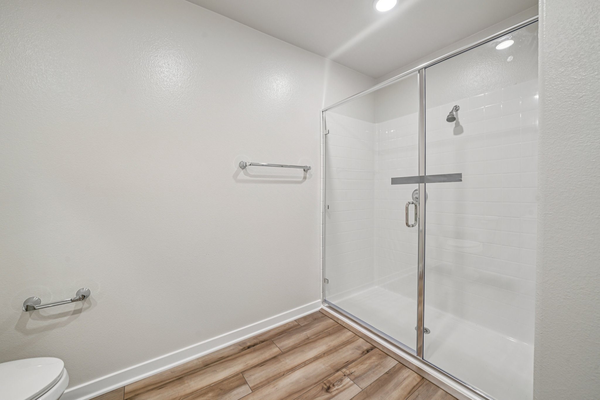 A bathroom with a glass shower.