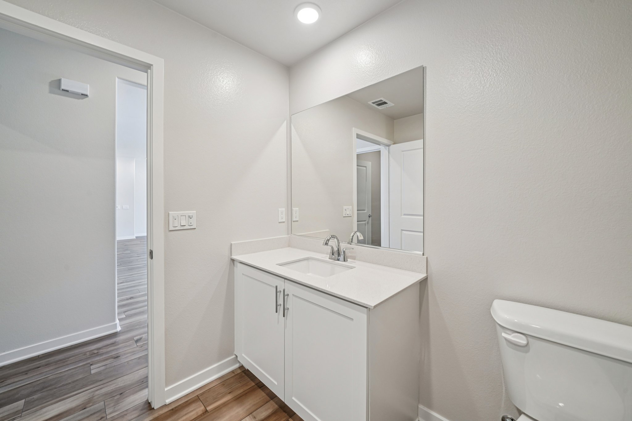 A bathroom with a sink and a toilet.