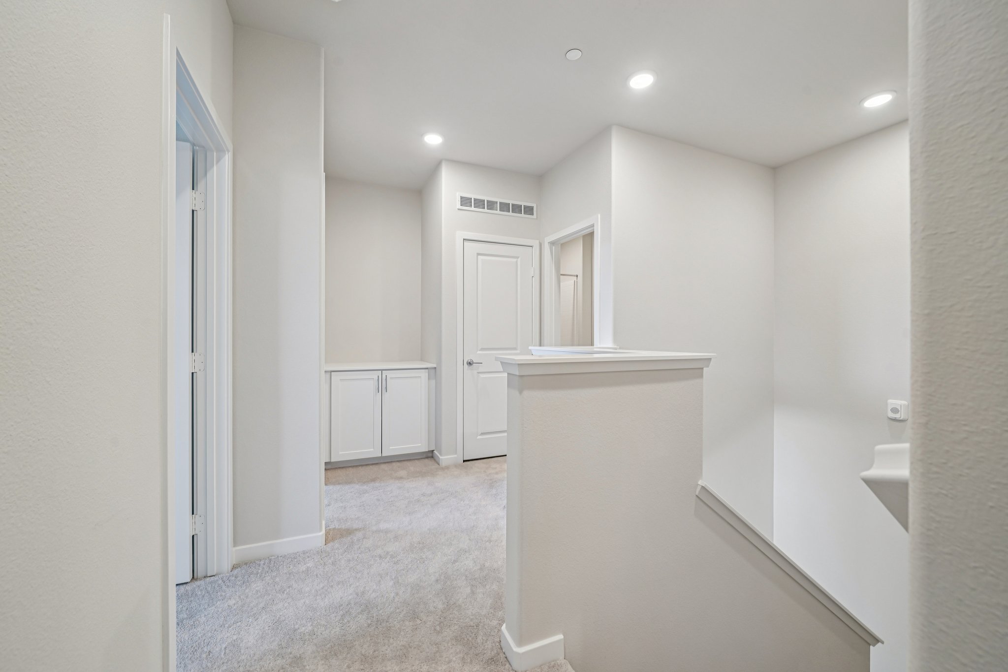A bathroom with white walls.