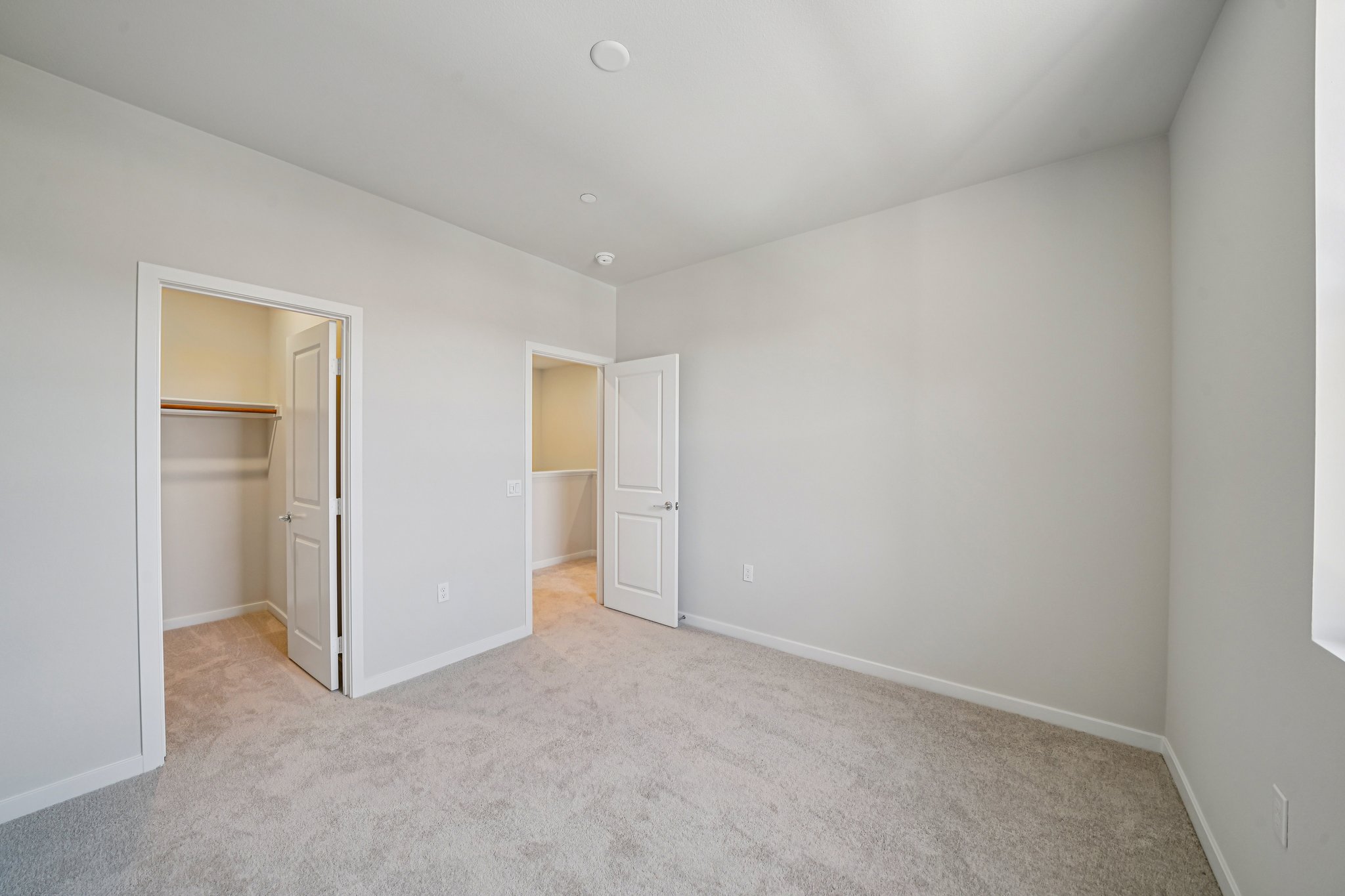 A hallway with white walls.