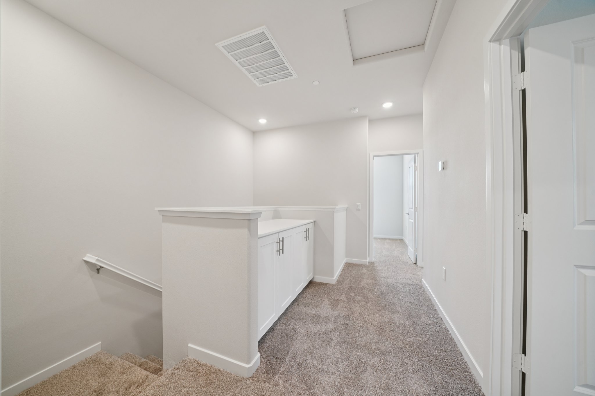 A room with white cabinets.