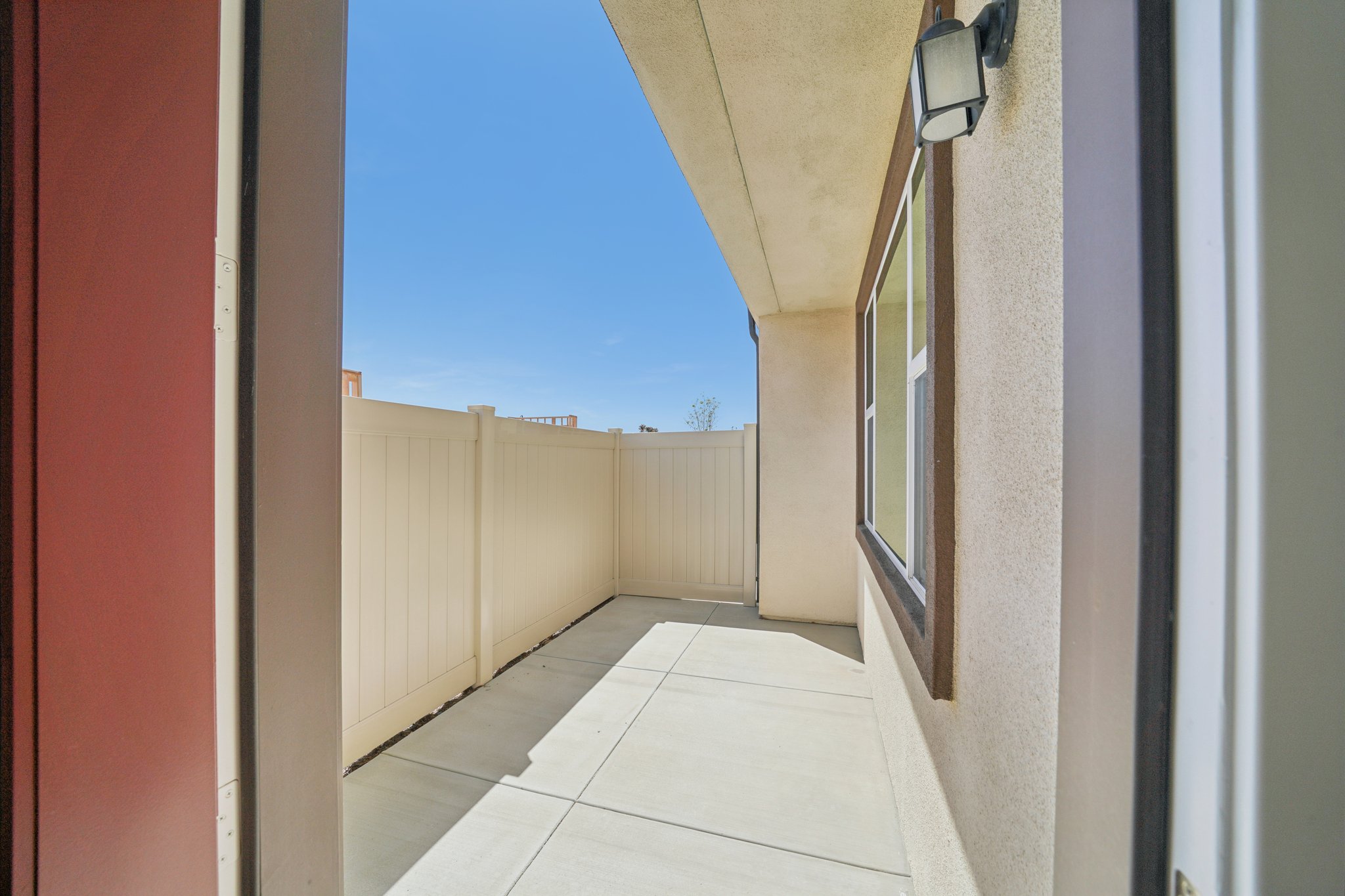 A hallway with white walls.