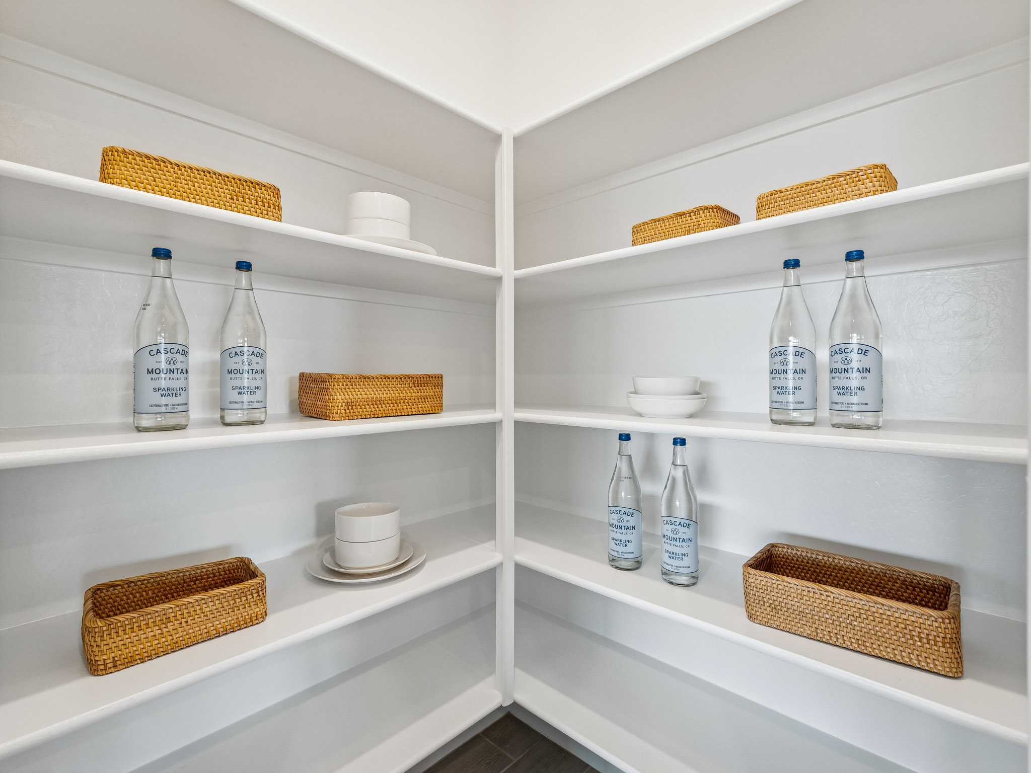 A white shelving unit with various items.