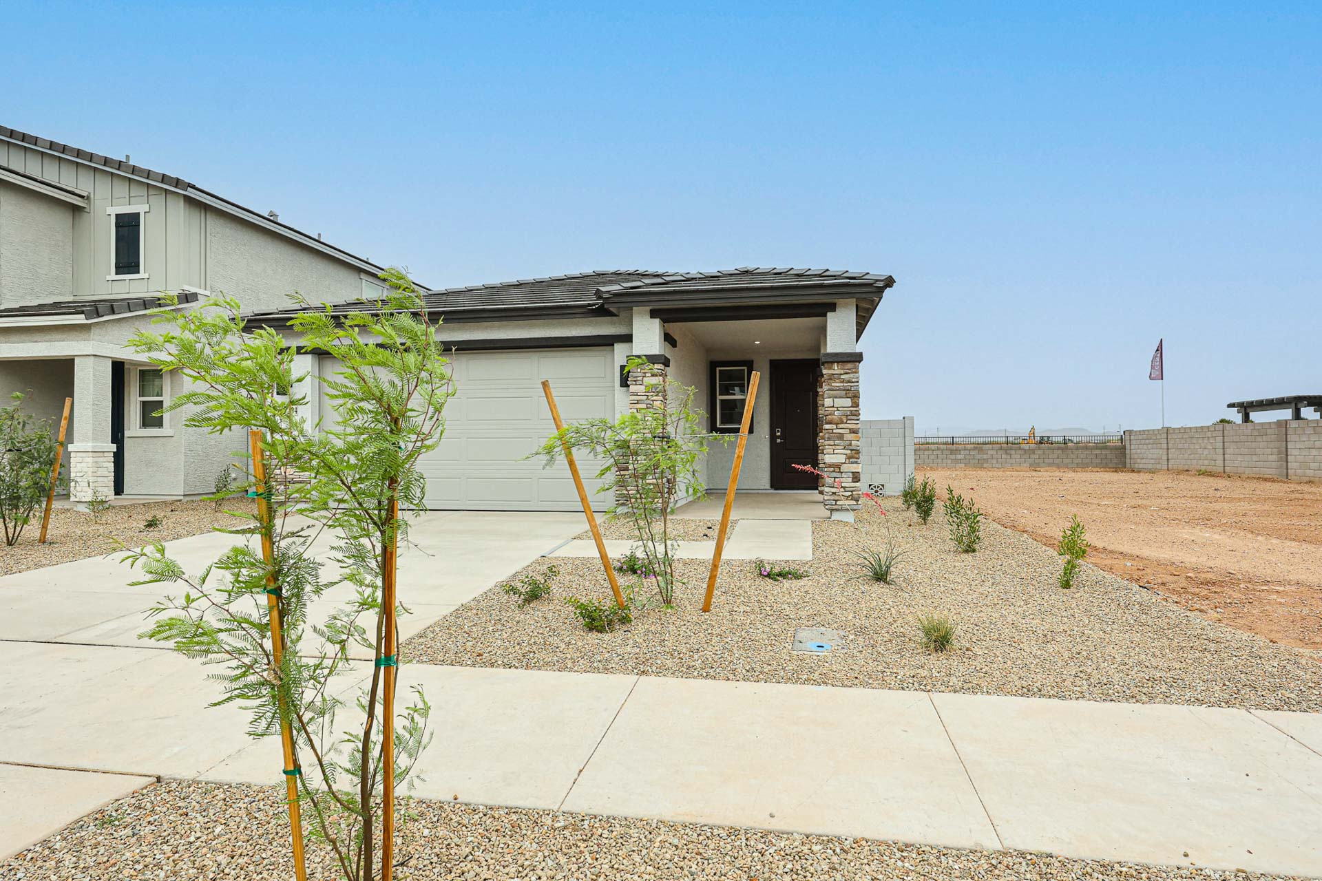 A house with a dirt yard.