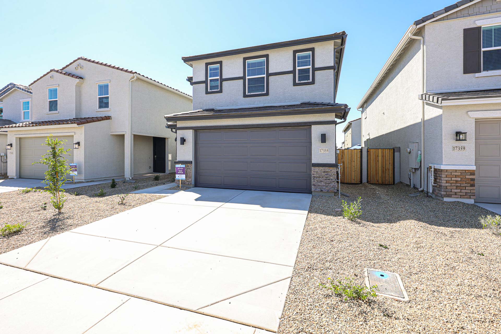 A driveway leading to a house.