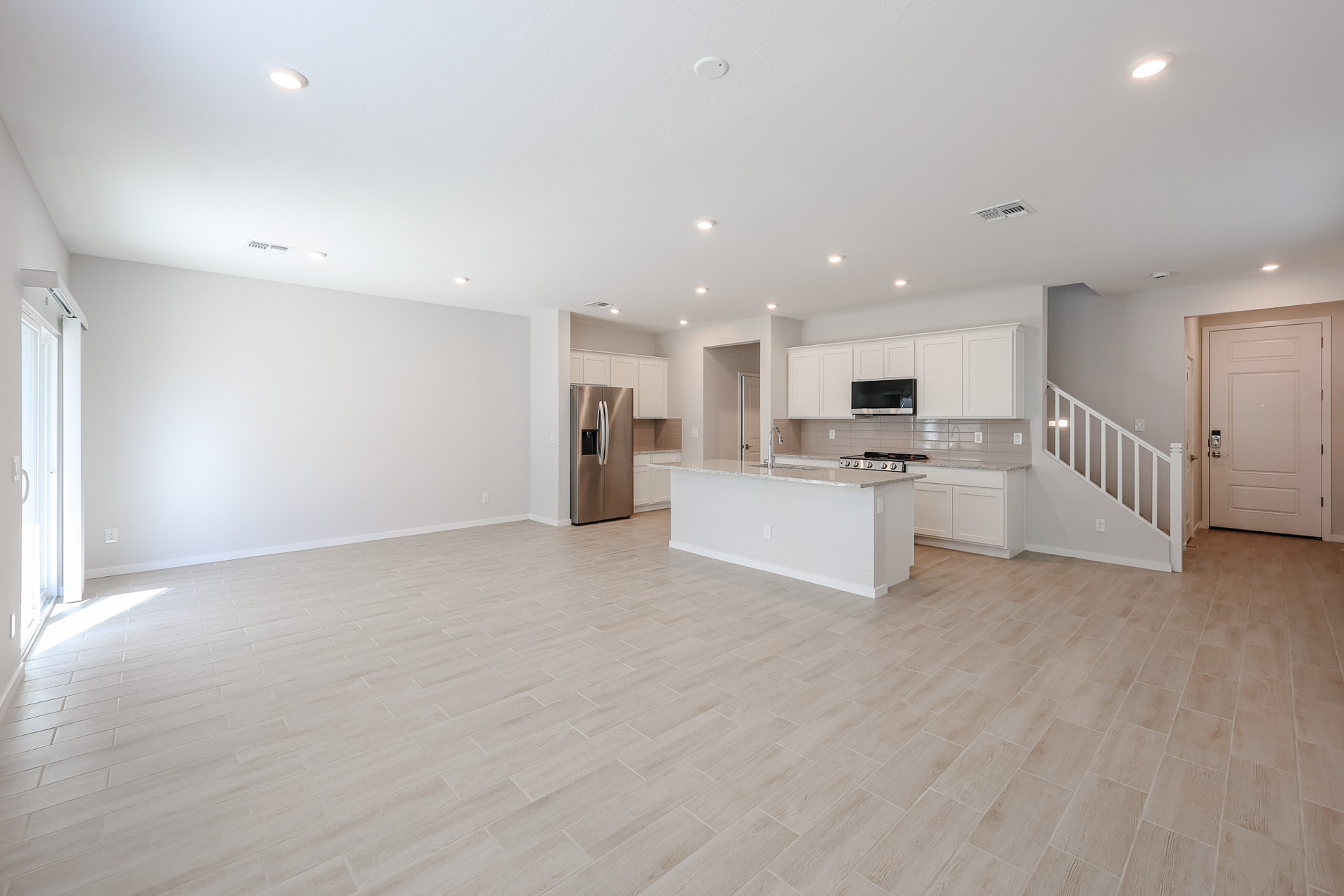 A large kitchen with white cabinets.