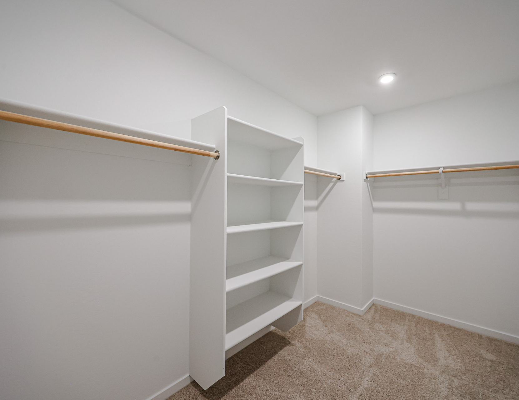 A white shelving unit in a room.