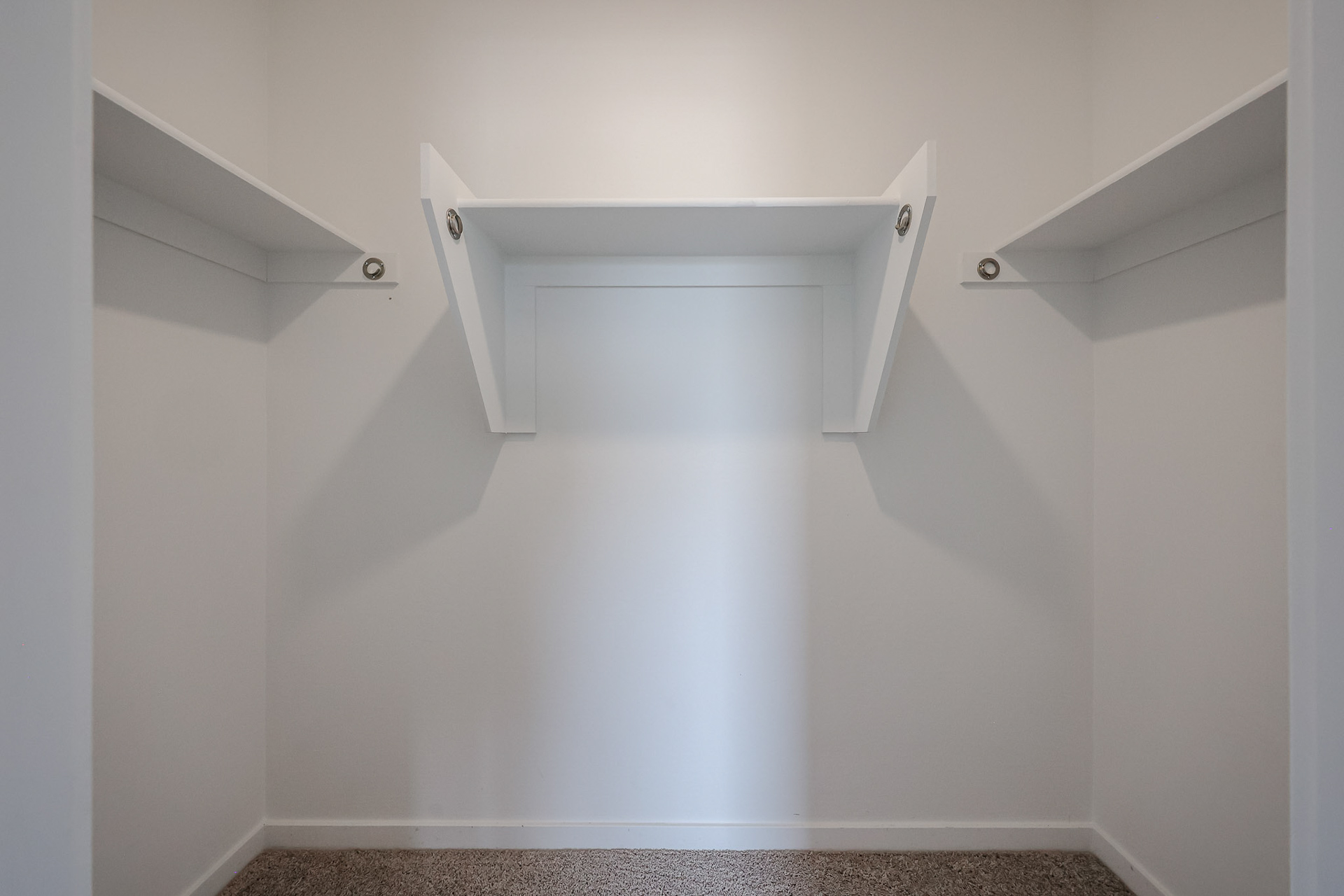 A white staircase with a door.