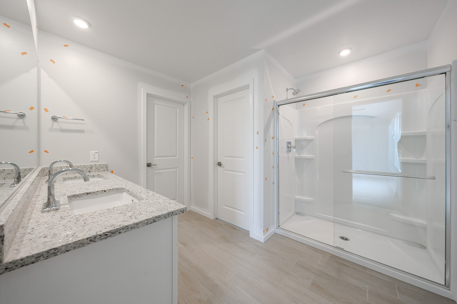 A bathroom with a glass shower.