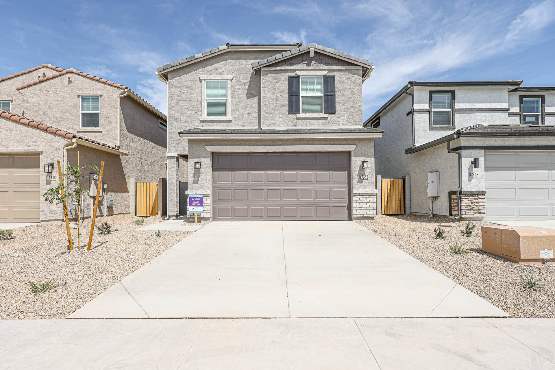 A house with garages and a driveway.
