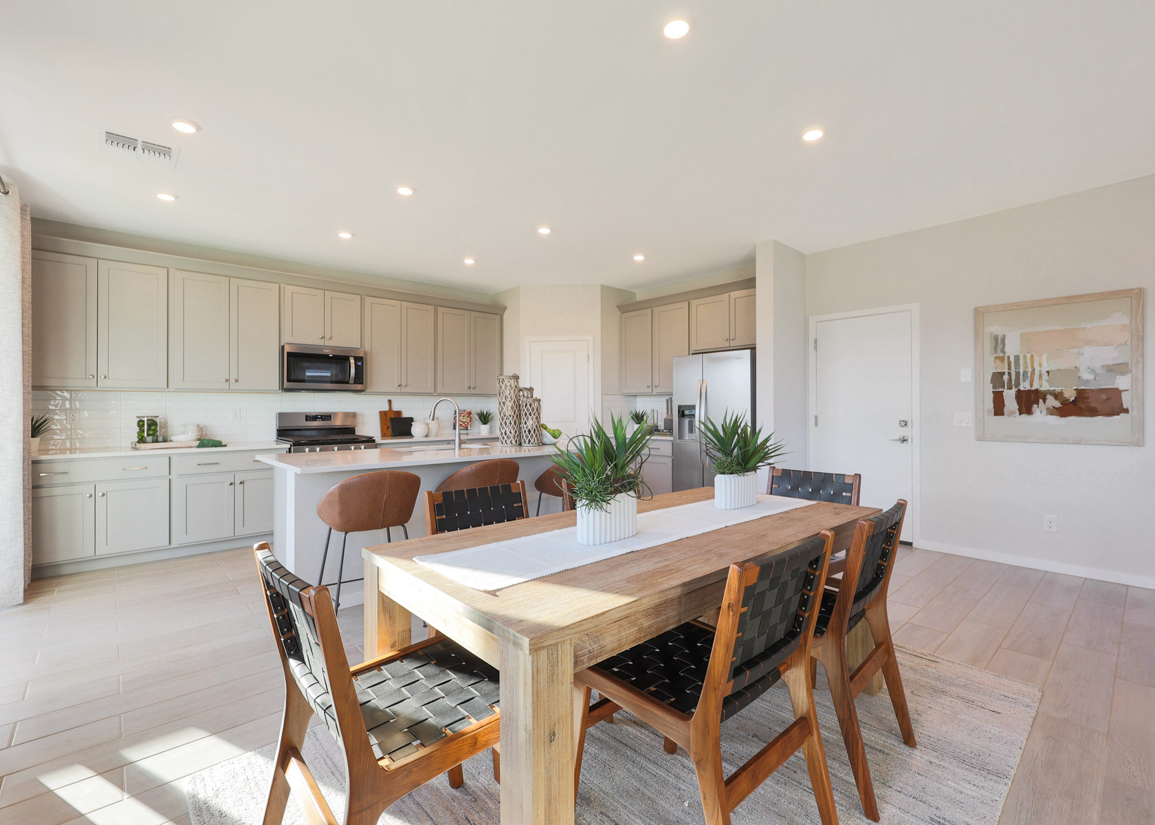 A kitchen with a dining table.