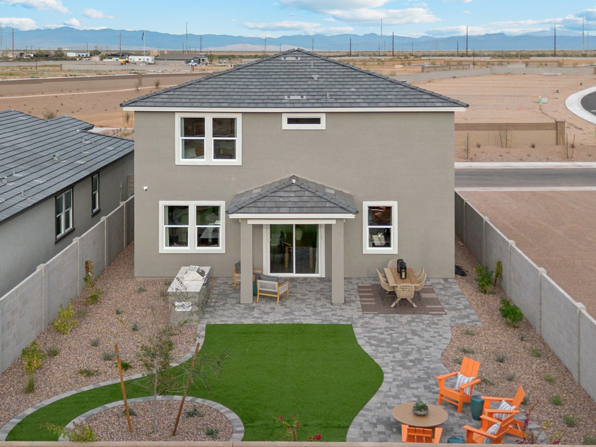 A house with a yard and a swimming pool.
