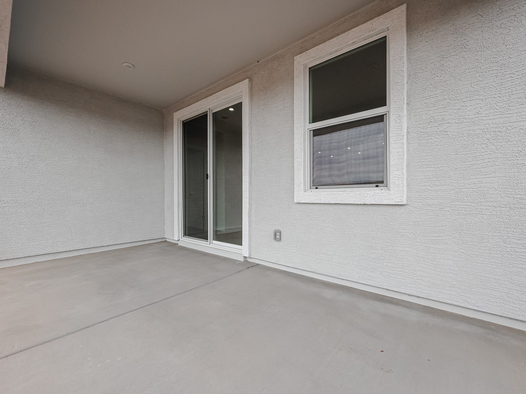 A room with a window and a door.