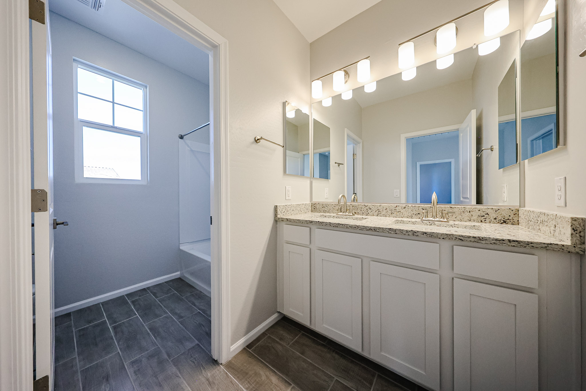 A bathroom with a tub and sink.