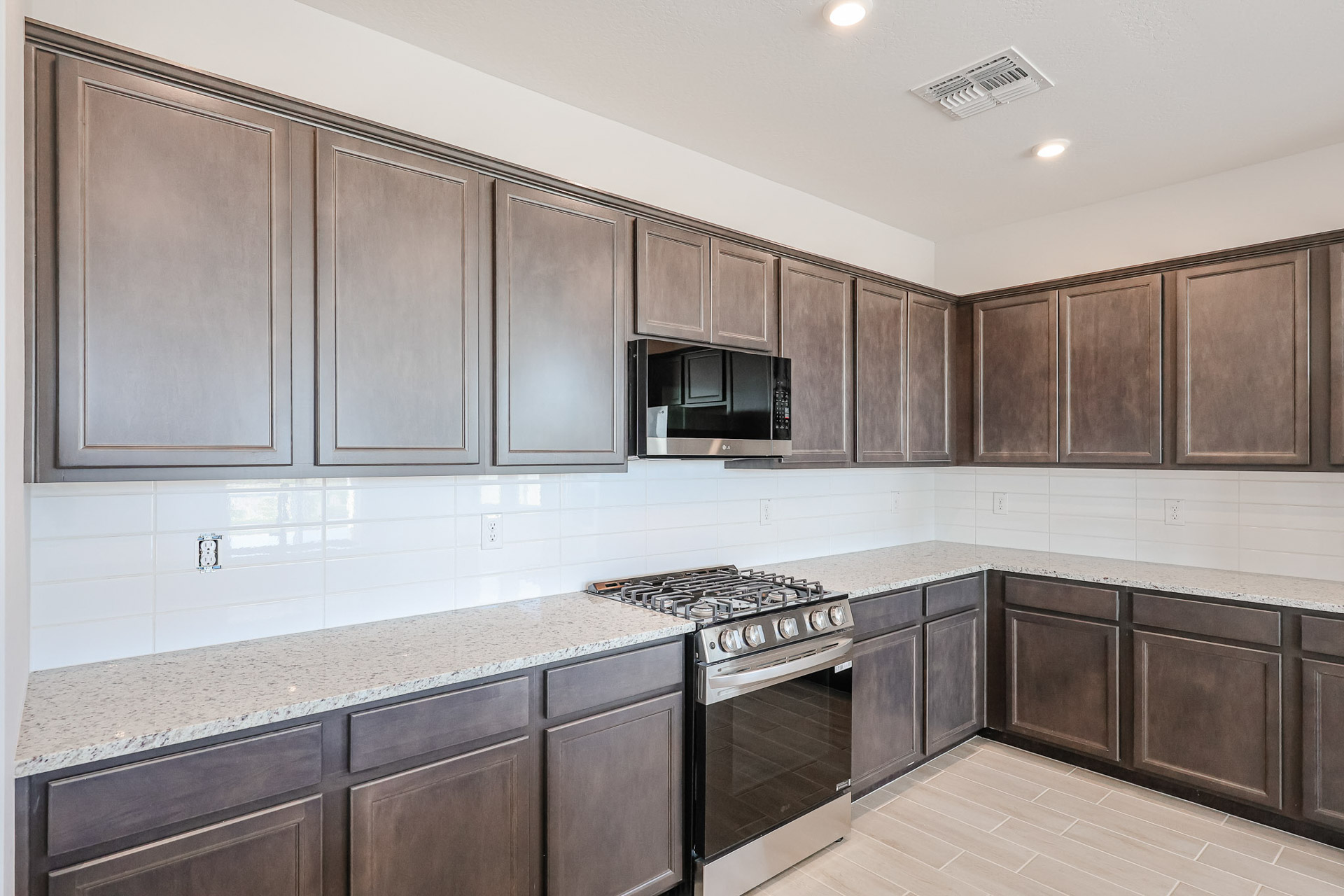 A kitchen with wooden cabinets.