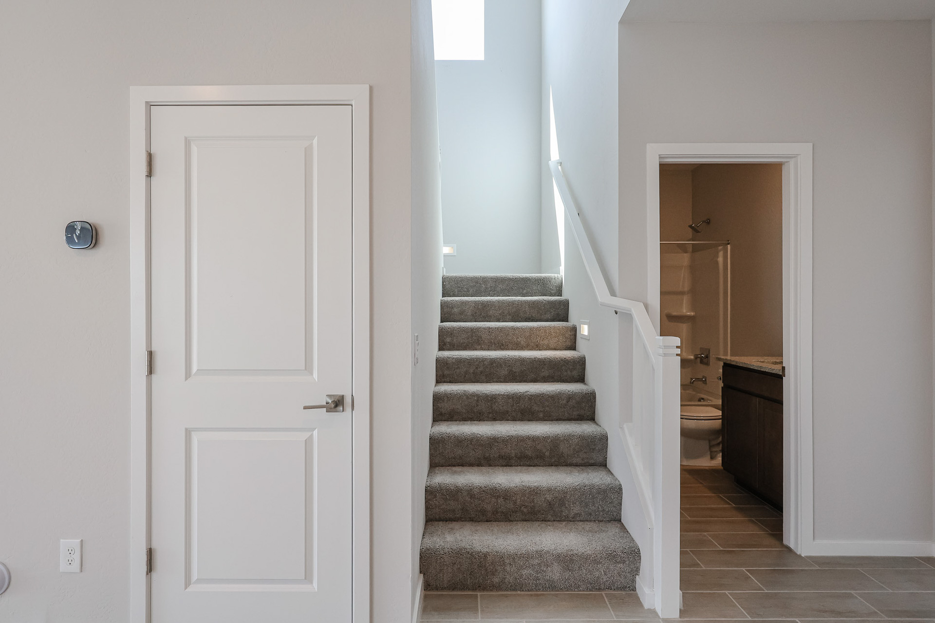 A staircase leading to a door.