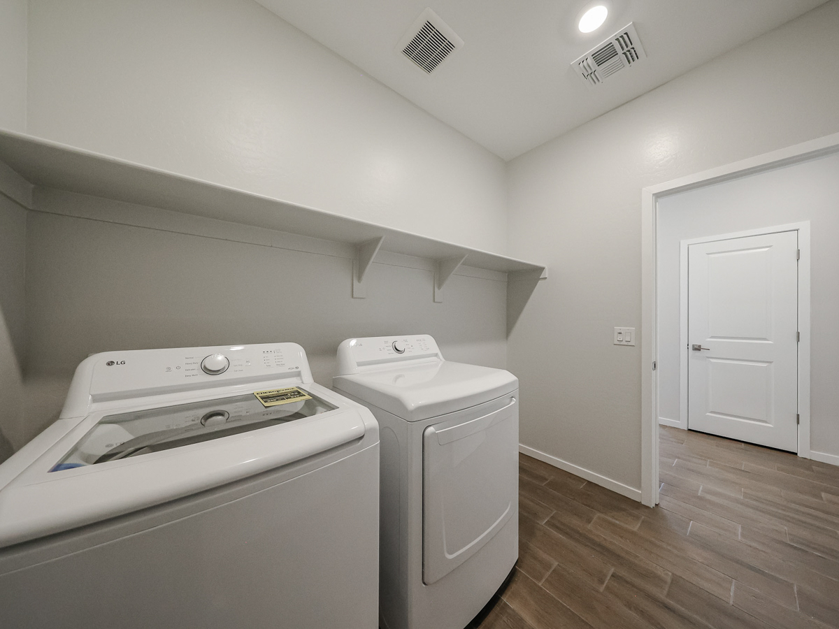 A laundry room with a washer and dryer.