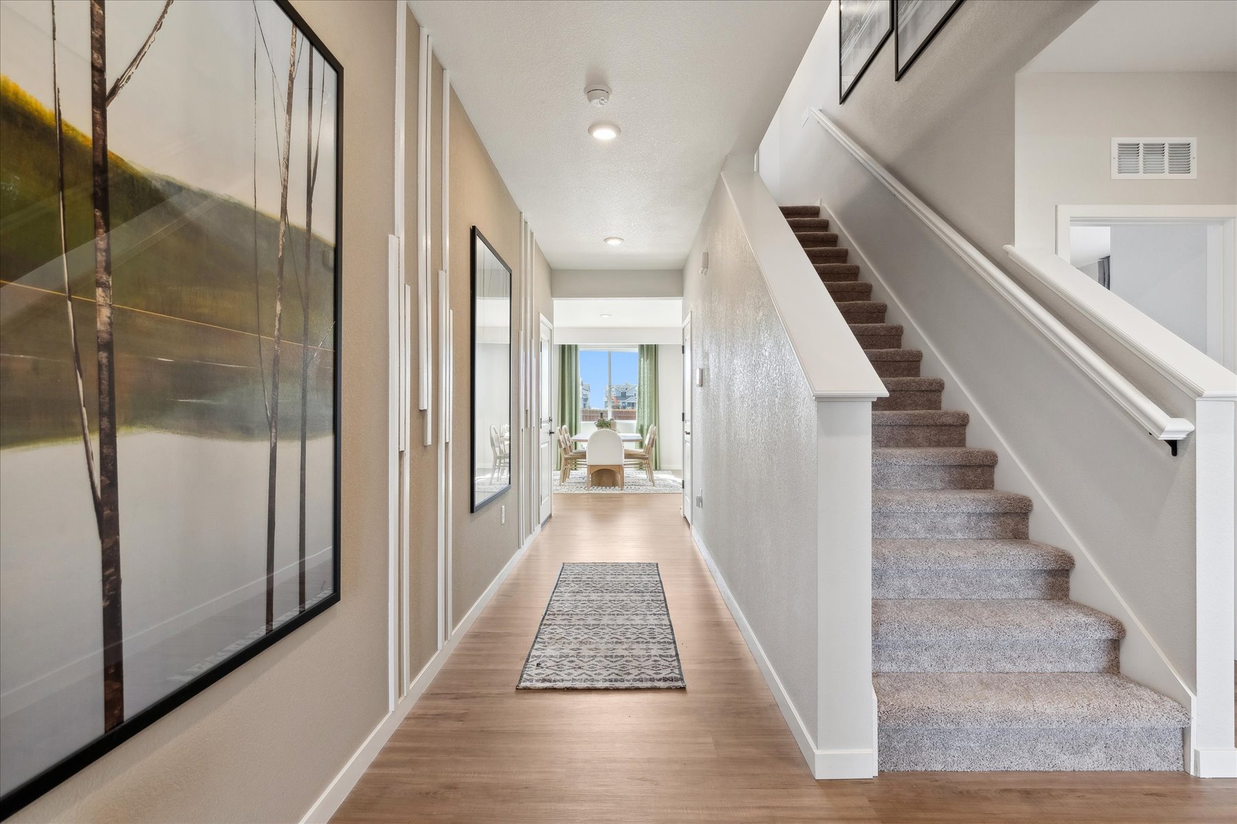A long hallway with white walls.