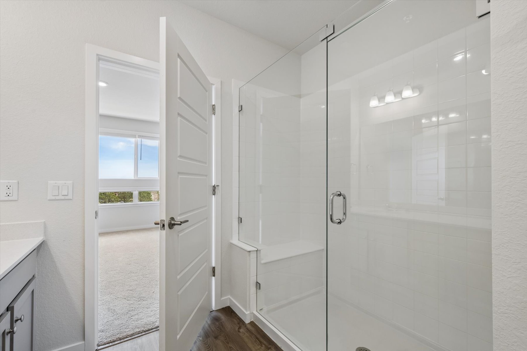 A bathroom with a glass shower.