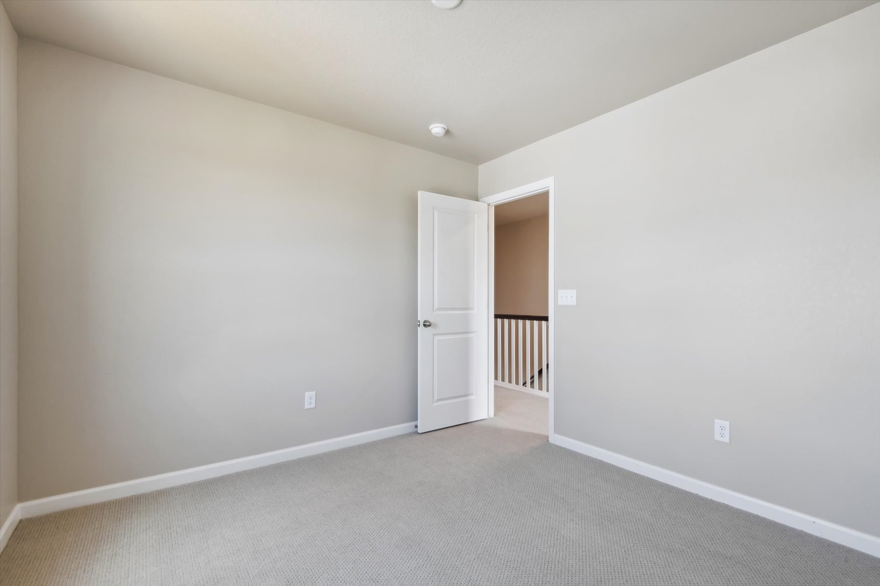 A room with a door and a window.