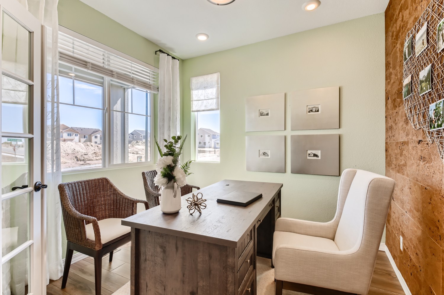 A kitchen with a table and chairs.
