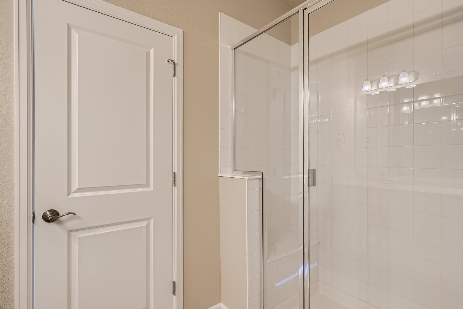 A shower unit and a door.