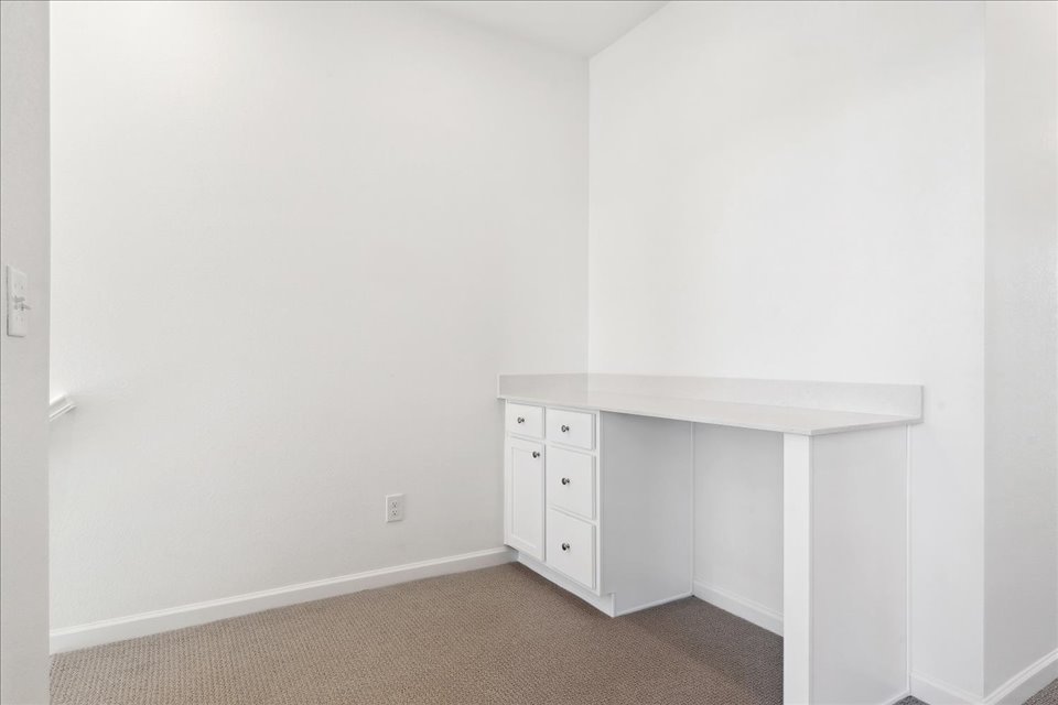 A white room with a white wall.