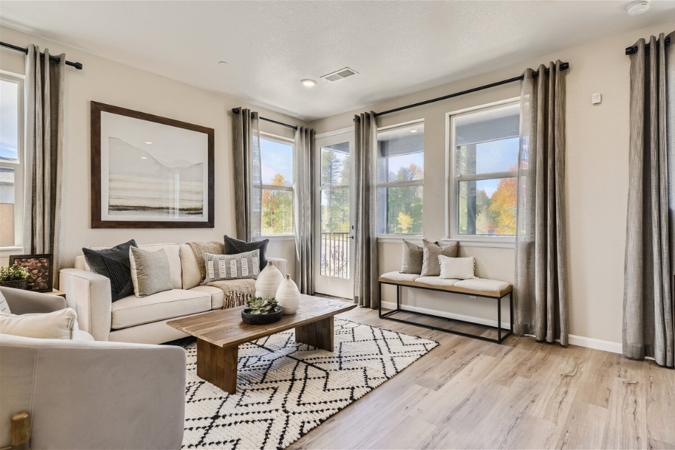 A living room with a large window.