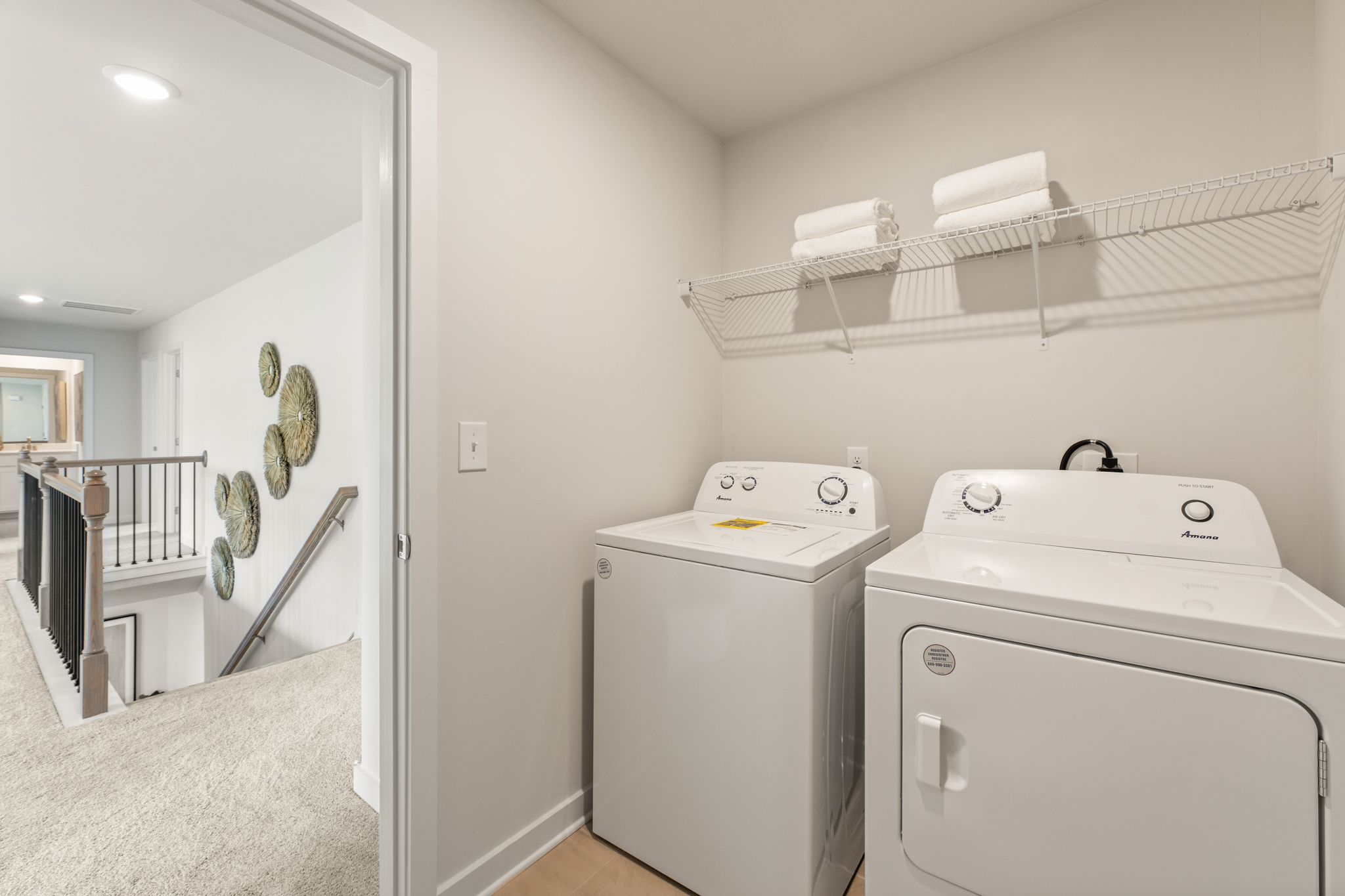 A washer and dryer in a bathroom.