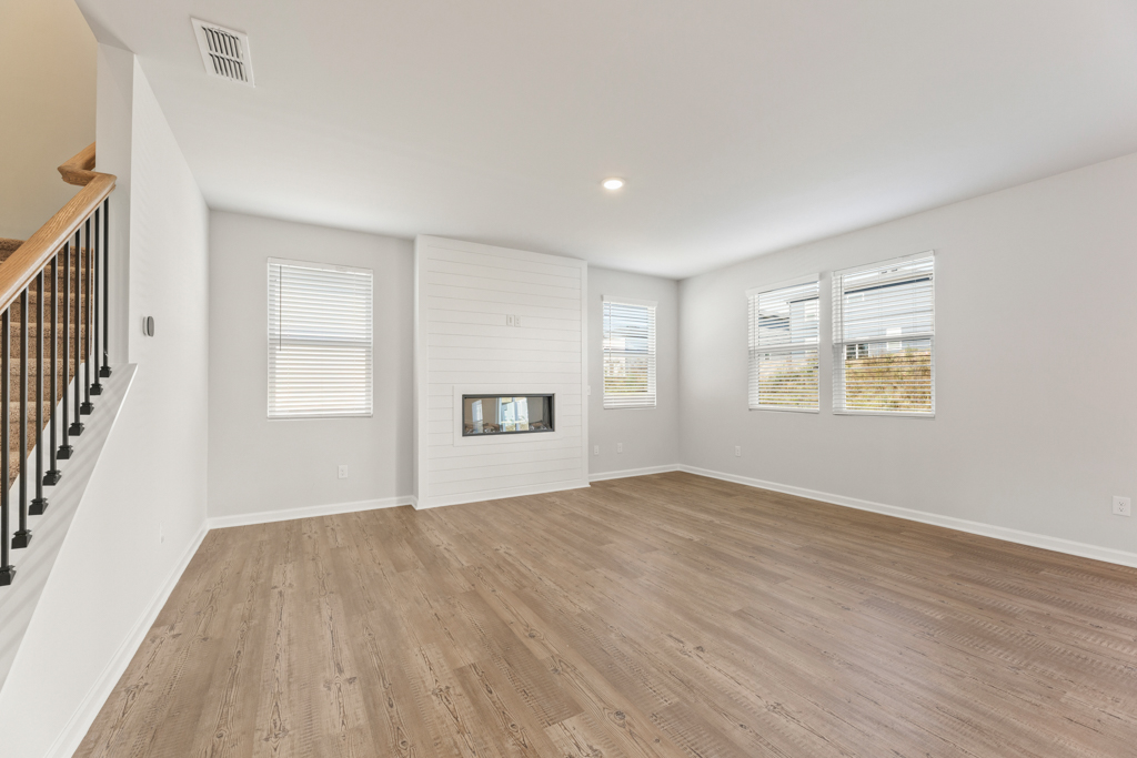 A room with a wood floor and a wood floor.