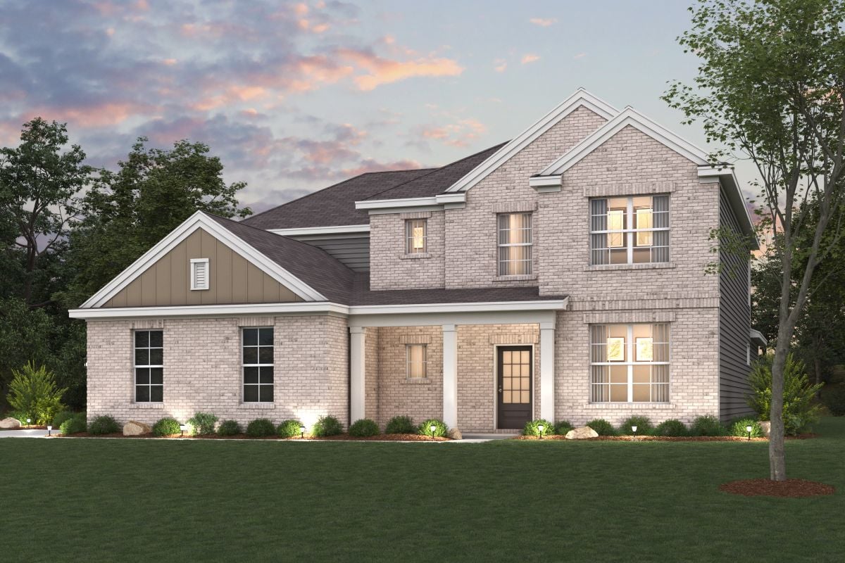 A large house with a lawn in front of it.