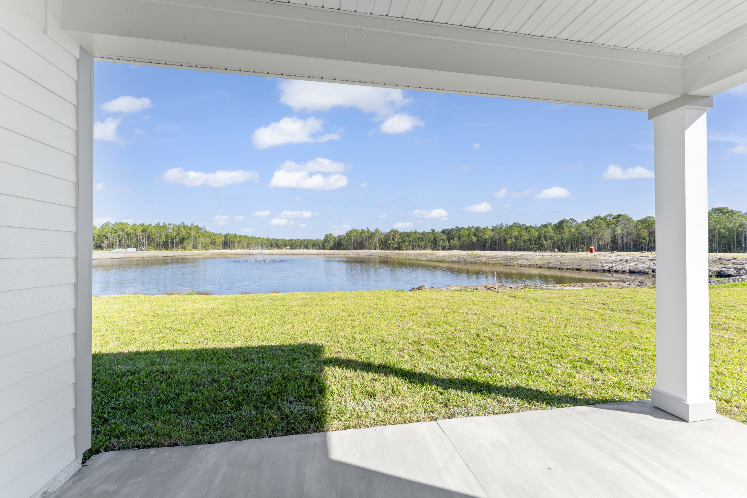 Lot 145 Covered Patio with View of Pond and Fountain at Camden Woods in Kingsland