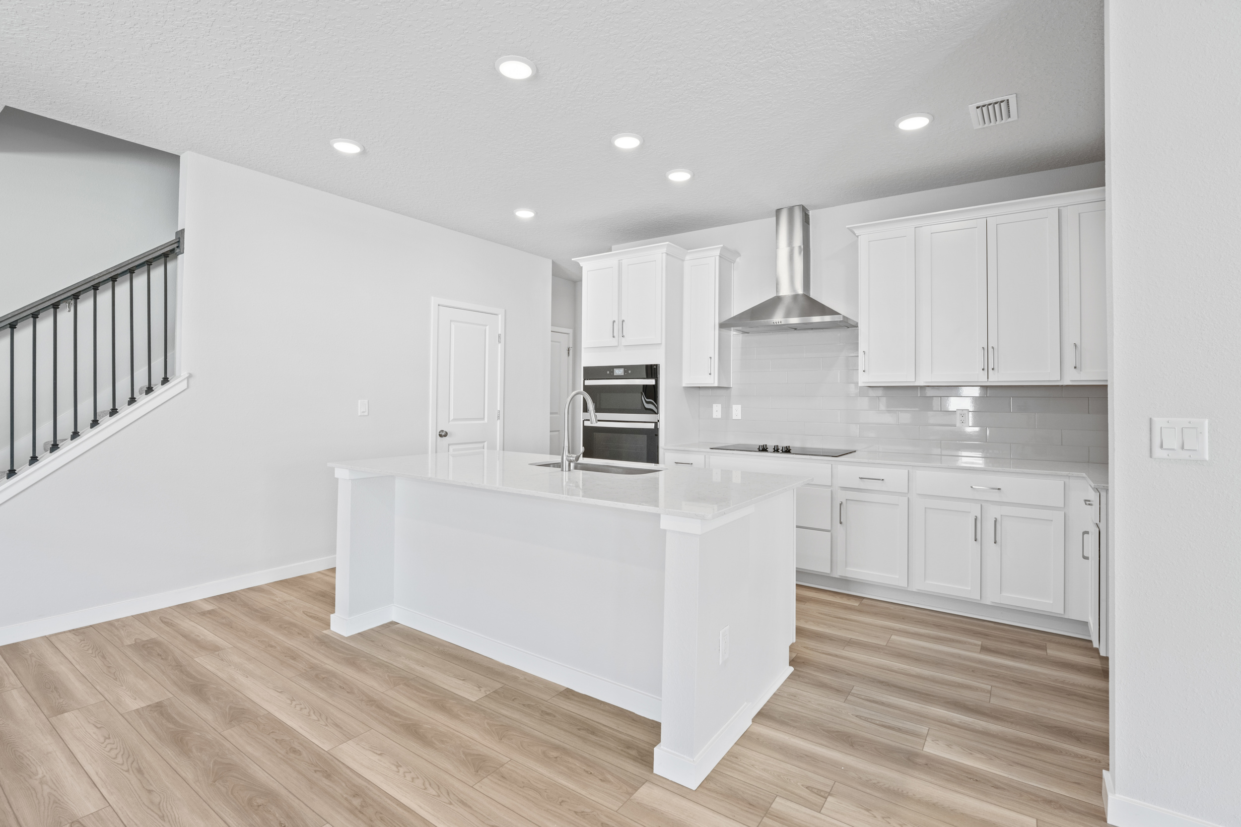 Lot 22 Chef's Kitchen with White Cabinets at Camden Woods in Kingsland