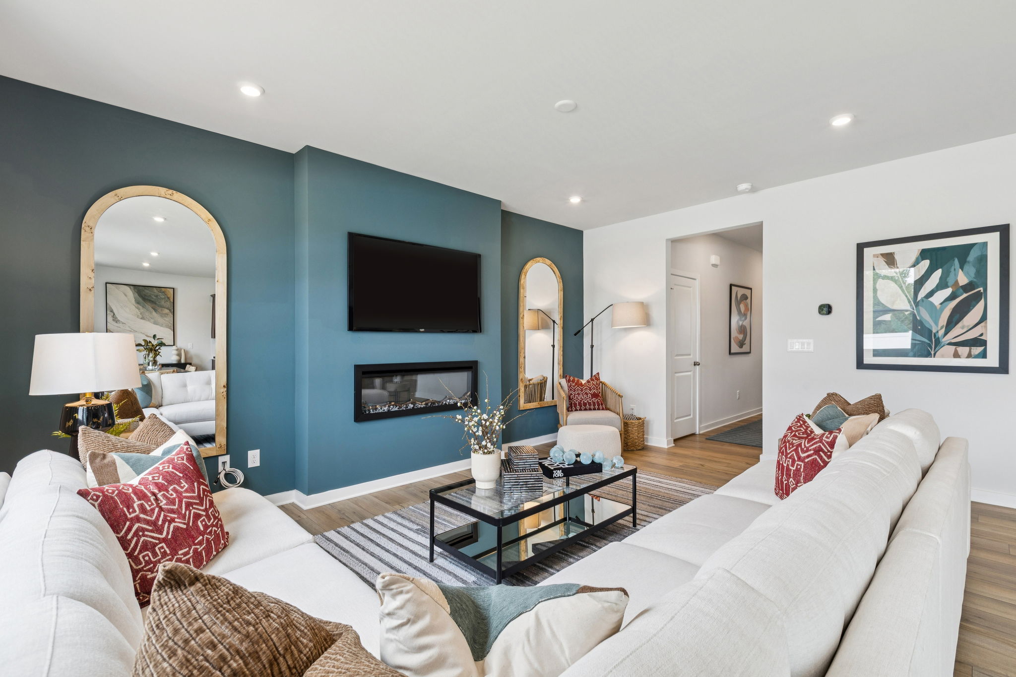 A living room with a large blue wall.