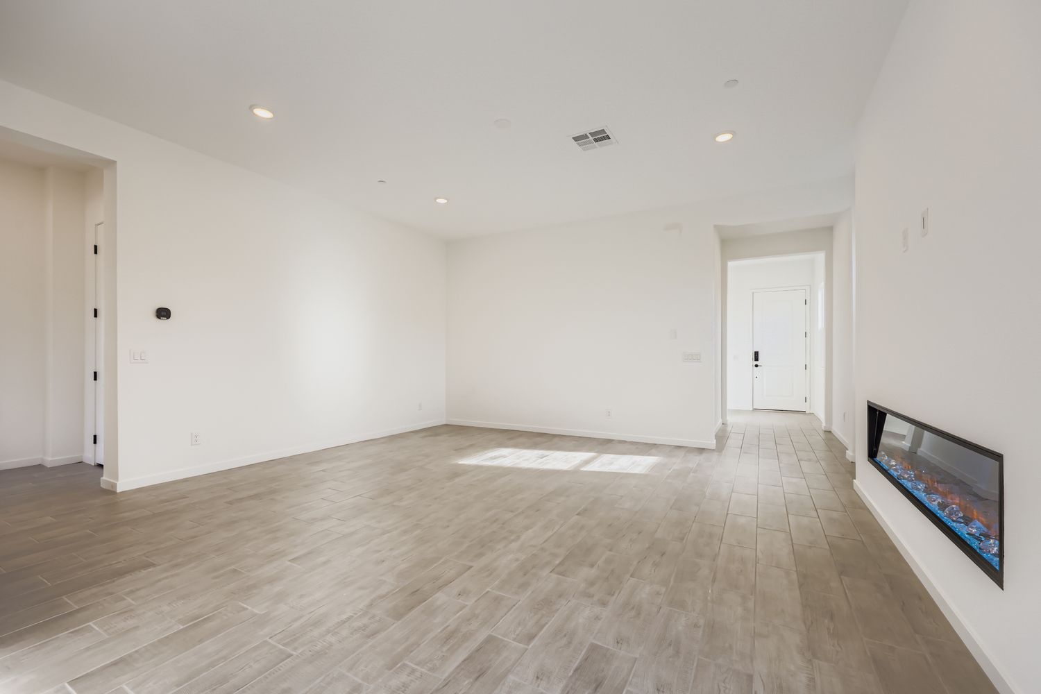 A room with a wood floor and a wood floor.