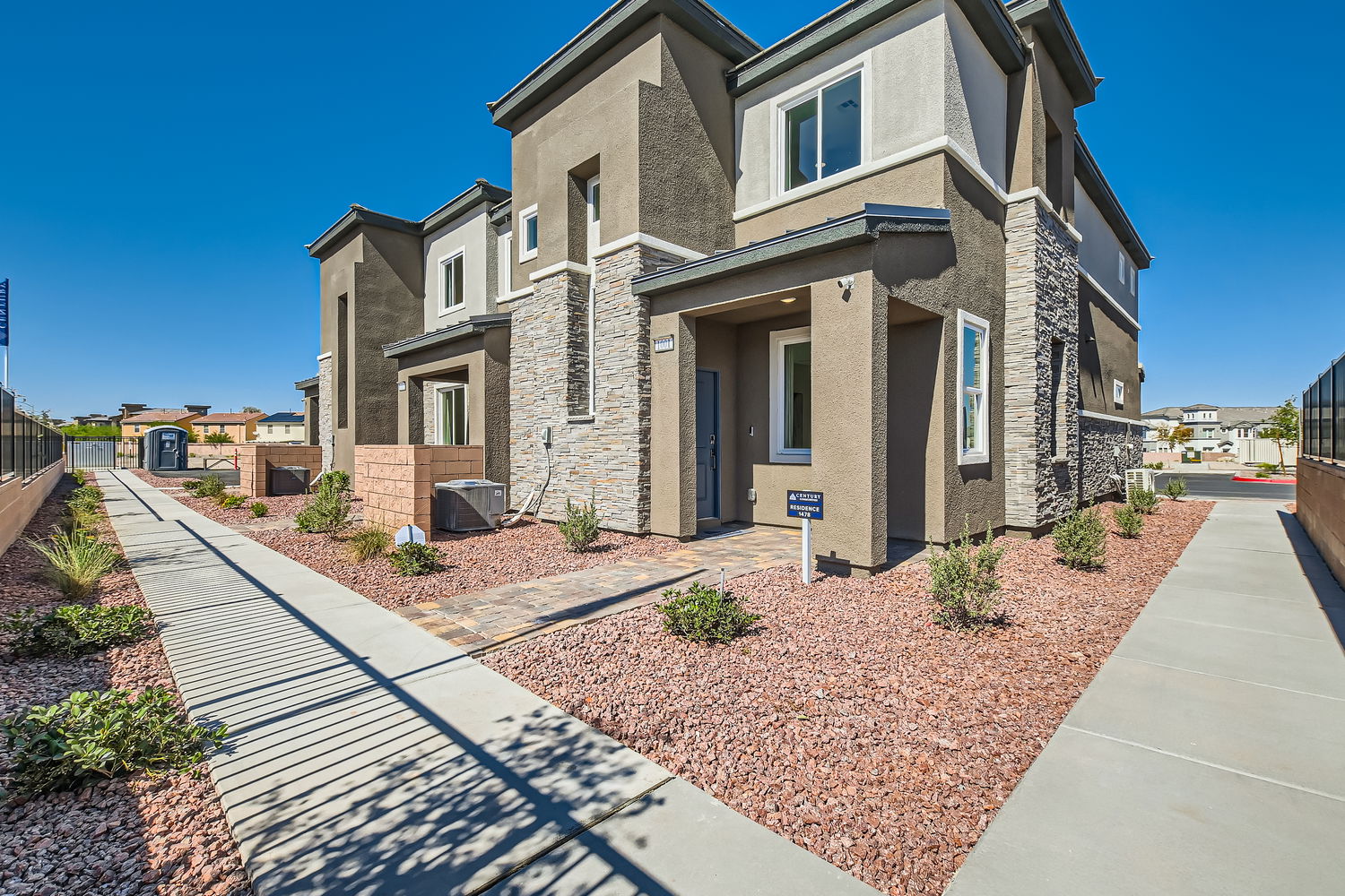 A brick building with a brick walkway.